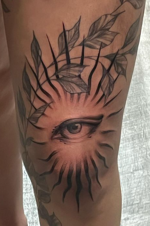 tattoo of an eye on knee